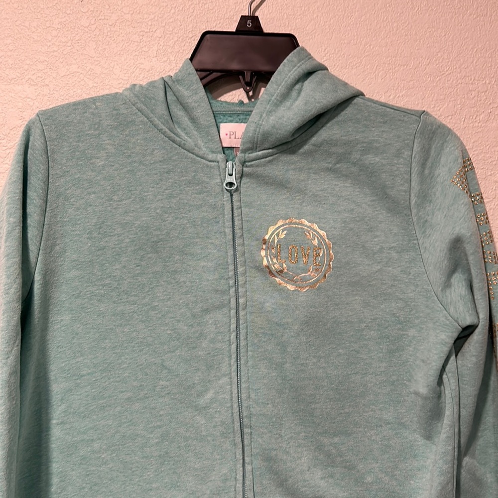 Place XXL-16 girls zip sweatshirt with hood.  Teal with gold lettering on arm